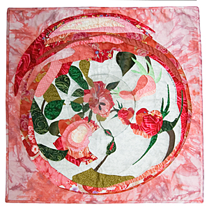 Anamorphic Roses, anamorphic quilt by Rose Rushbrooke. Hand dyed and printed cotton fabric, flexible mirror, hand stitched. Image copyright © Rose Rushbrooke.