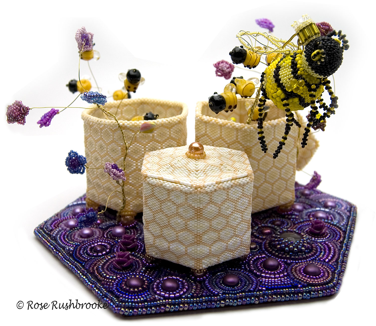 Queen Bee and Swarm, beaded sculpture by Rose Rushbrooke. Bead weaving and embroidery. Seed beads, crystals, Czech glass beads, and copper wire. Finalist in inaugural exhibition Wings and Stings by the Museum of Beadwork. Image copyright © Rose Rushbrooke.