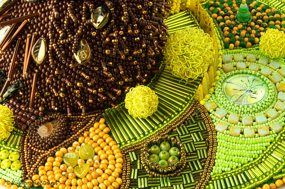 Close up 3 of Triffid - seed beads, crystals, Czech glass beads, ceramic focal, ammonites, and selected beads. Peyote stitch beadweaving, bead embroidery. BeadDreams 2018 finalist. Image copyright © Rose Rushbrooke.