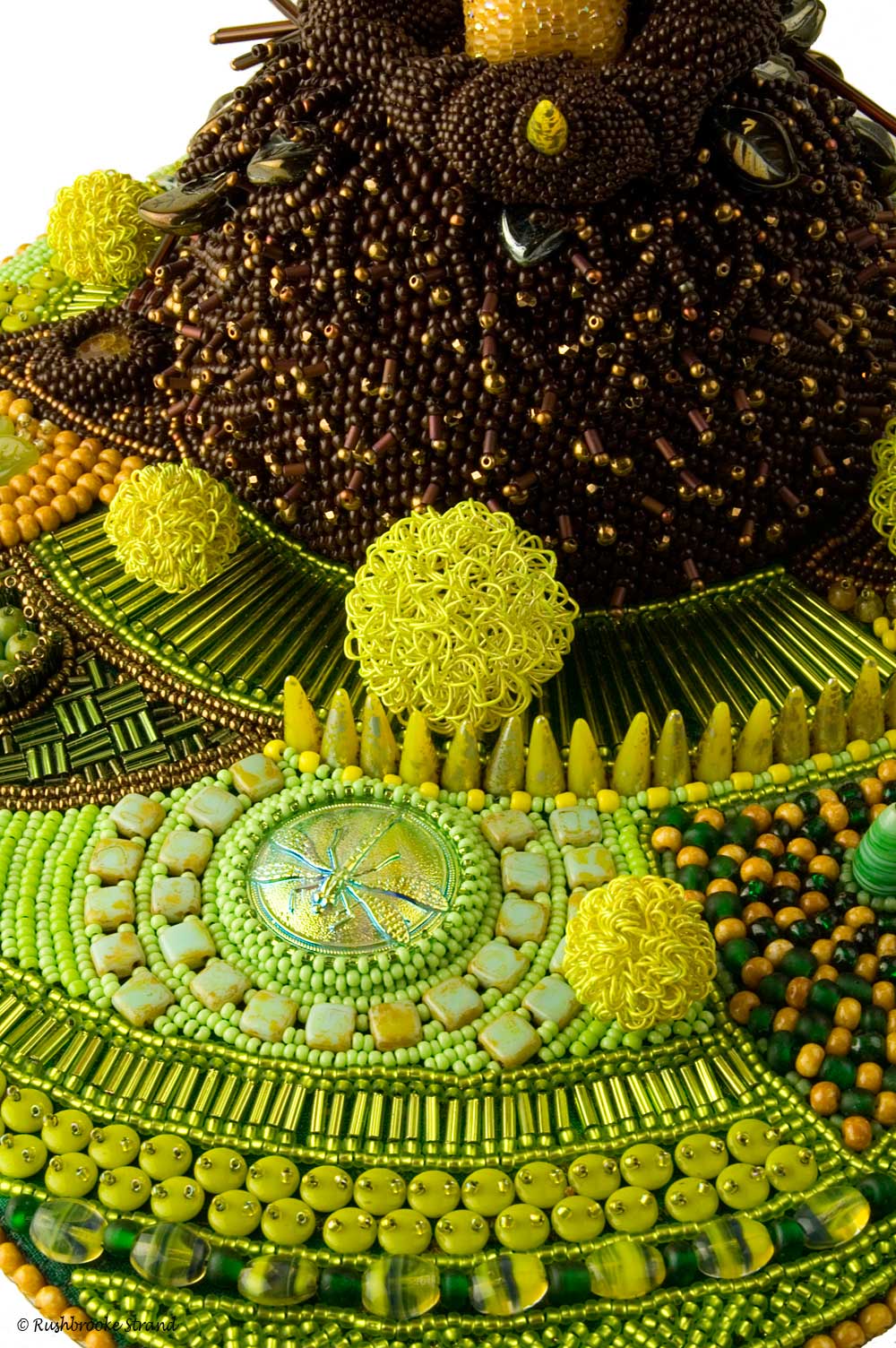 Close up 2 of Triffid - seed beads, crystals, Czech glass beads, ceramic focal, ammonites, and selected beads. Peyote stitch beadweaving, bead embroidery. BeadDreams 2018 finalist. Image copyright © Rose Rushbrooke.