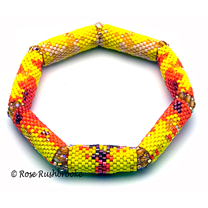 Monsella Tulip Bracelet by Rose Rushbrooke. Delicas, glass seed beads, and fire polish crystals. Peyote Stitch. Image copyright © Rose Rushbrooke.